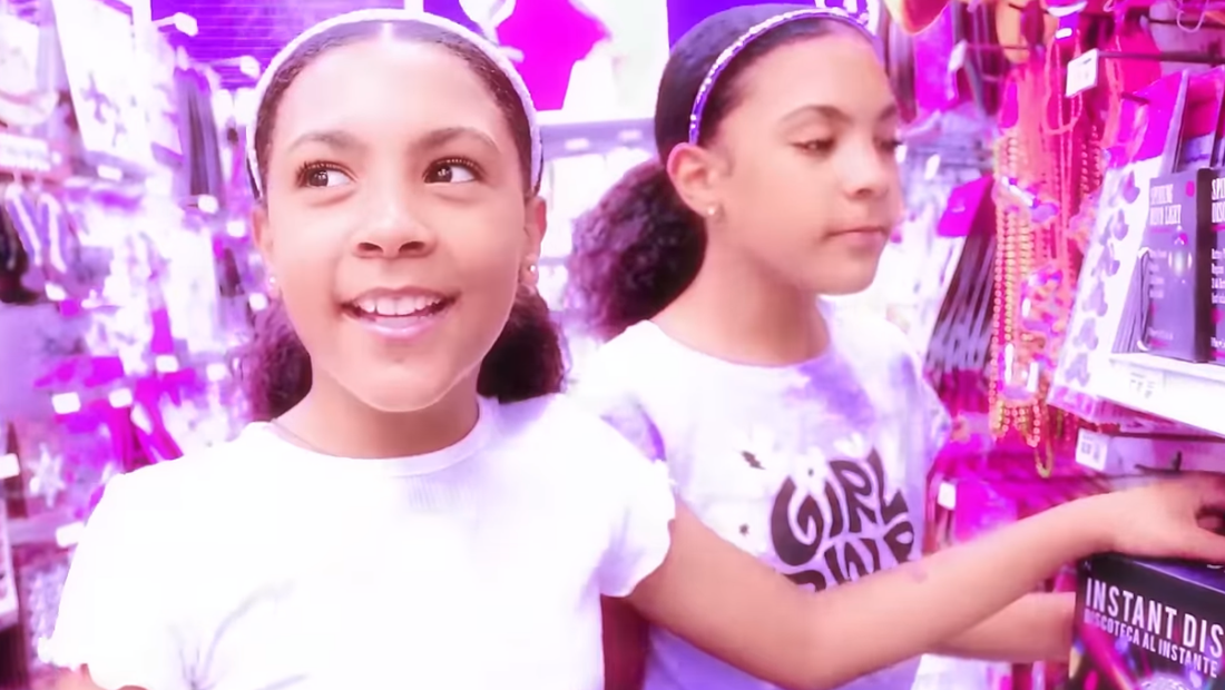 Screenshot from a long-form YouTube video featuring Gen Z influencers The McClure Twins doing a shop-along at Party City as part of an integrated Mother’s Day campaign. The twins are browsing themed party supplies, engaging with each other and the camera in a fun, family-friendly tone.