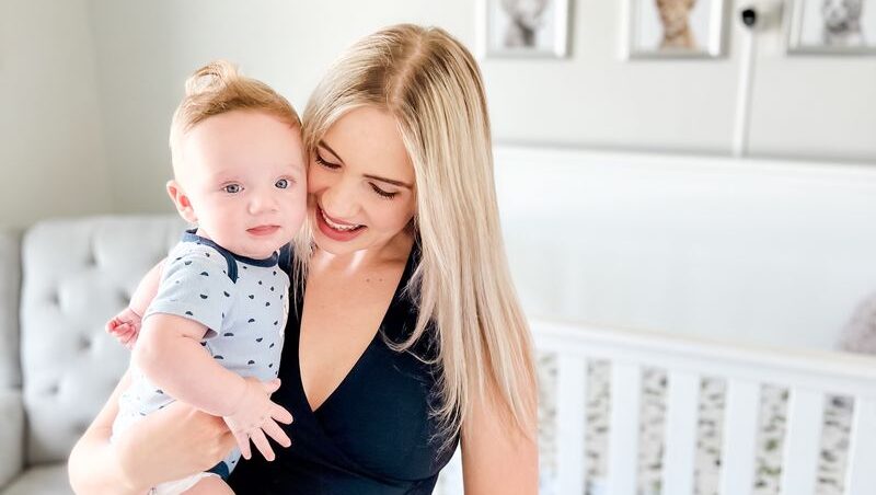Gen Z parent bonding with her infant, capturing the essence of modern motherhood for brands marketing to moms.